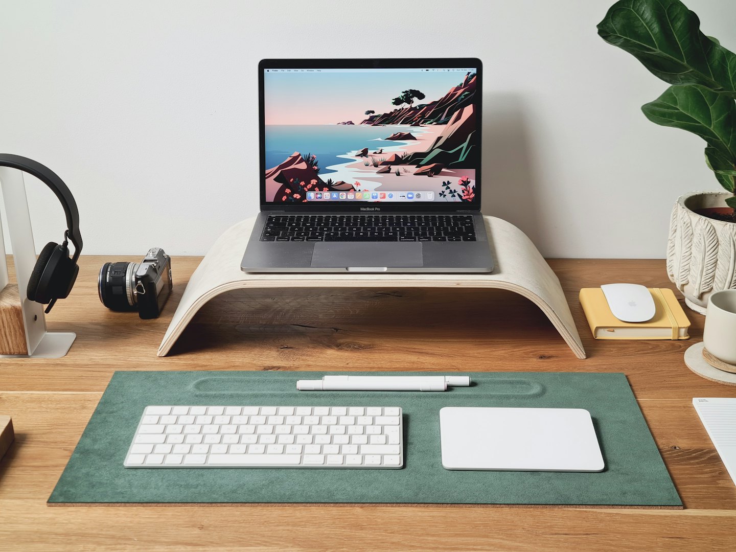 Modern desk setup featuring a laptop and office accessories.